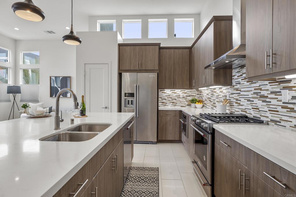 2026 Tango Loop, Unit 3 Chula Vista, CA 91915 - Photo 5 of 34 a kitchen with a sink stove and refrigerator