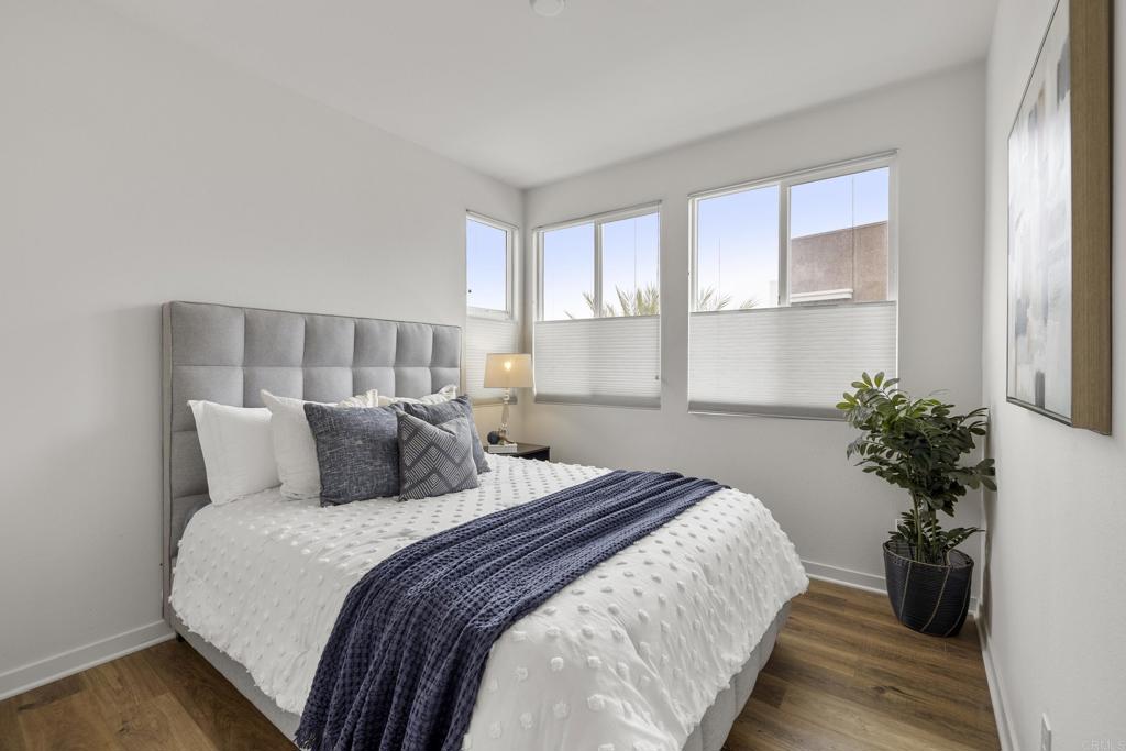 2026 Tango Loop, Unit 3 Chula Vista, CA 91915 - Photo 6 of 34 a bed sitting in a spacious bedroom next to a window and potted plant