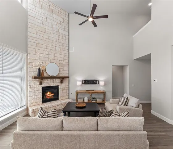 a living room with furniture and a fireplace
