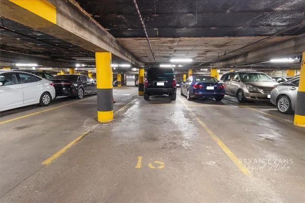a view of parking garage with cars