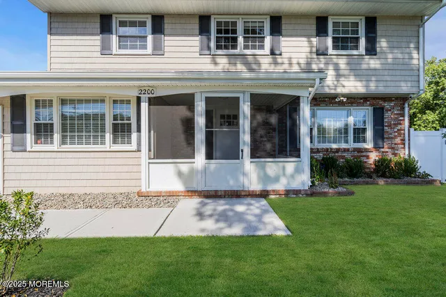 front view of a house that has a yard