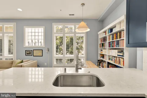 a view of kitchen with furniture and large window