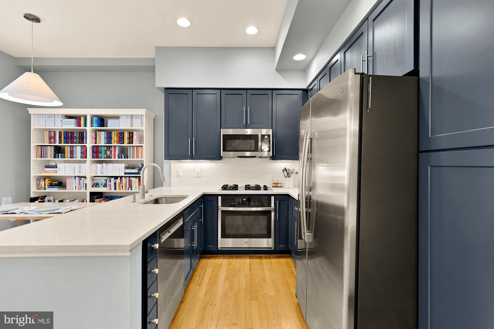 2363 Champlain Street Northwest, Unit 26 Washington, DC 20009 - Photo 13 of 35 a kitchen with stainless steel appliances a stove a refrigerator and a sink
