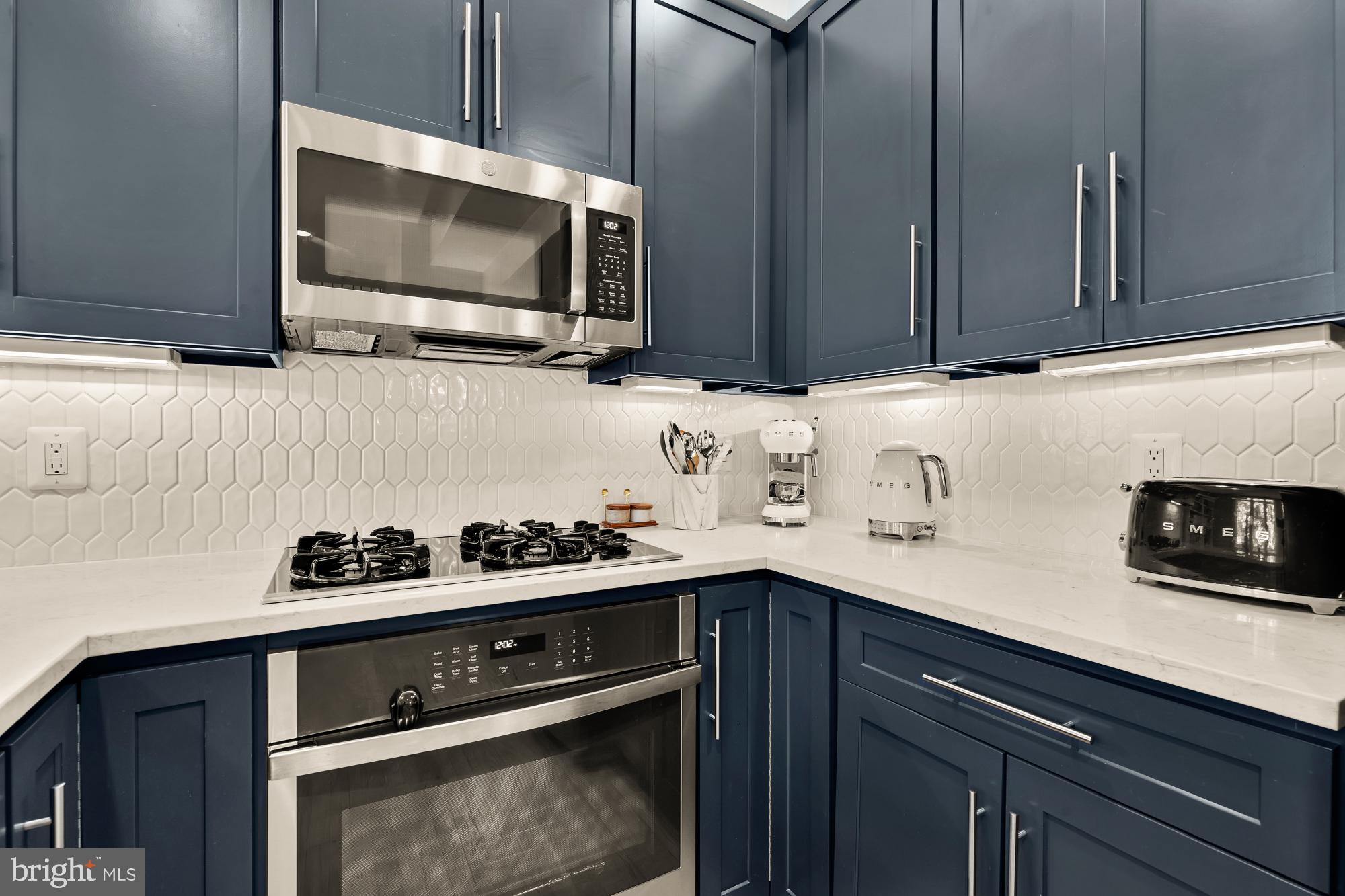 2363 Champlain Street Northwest, Unit 26 Washington, DC 20009 - Photo 15 of 35 a kitchen with a sink and cabinets