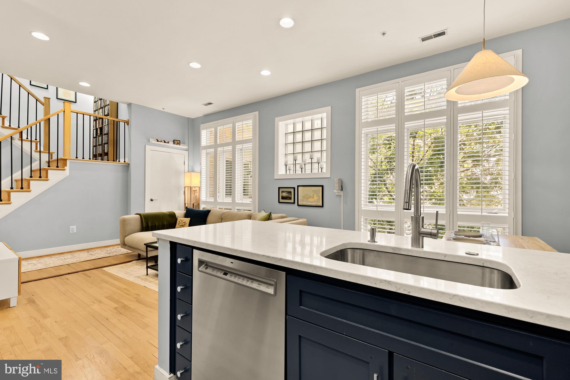 2363 Champlain Street Northwest, Unit 26 Washington, DC 20009 - Photo 16 of 35 a kitchen with a sink and large windows