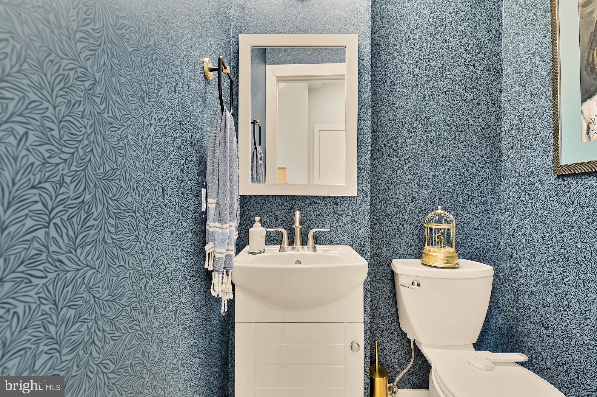 2363 Champlain Street Northwest, Unit 26 Washington, DC 20009 - Photo 17 of 35 a bathroom with a toilet sink and mirror