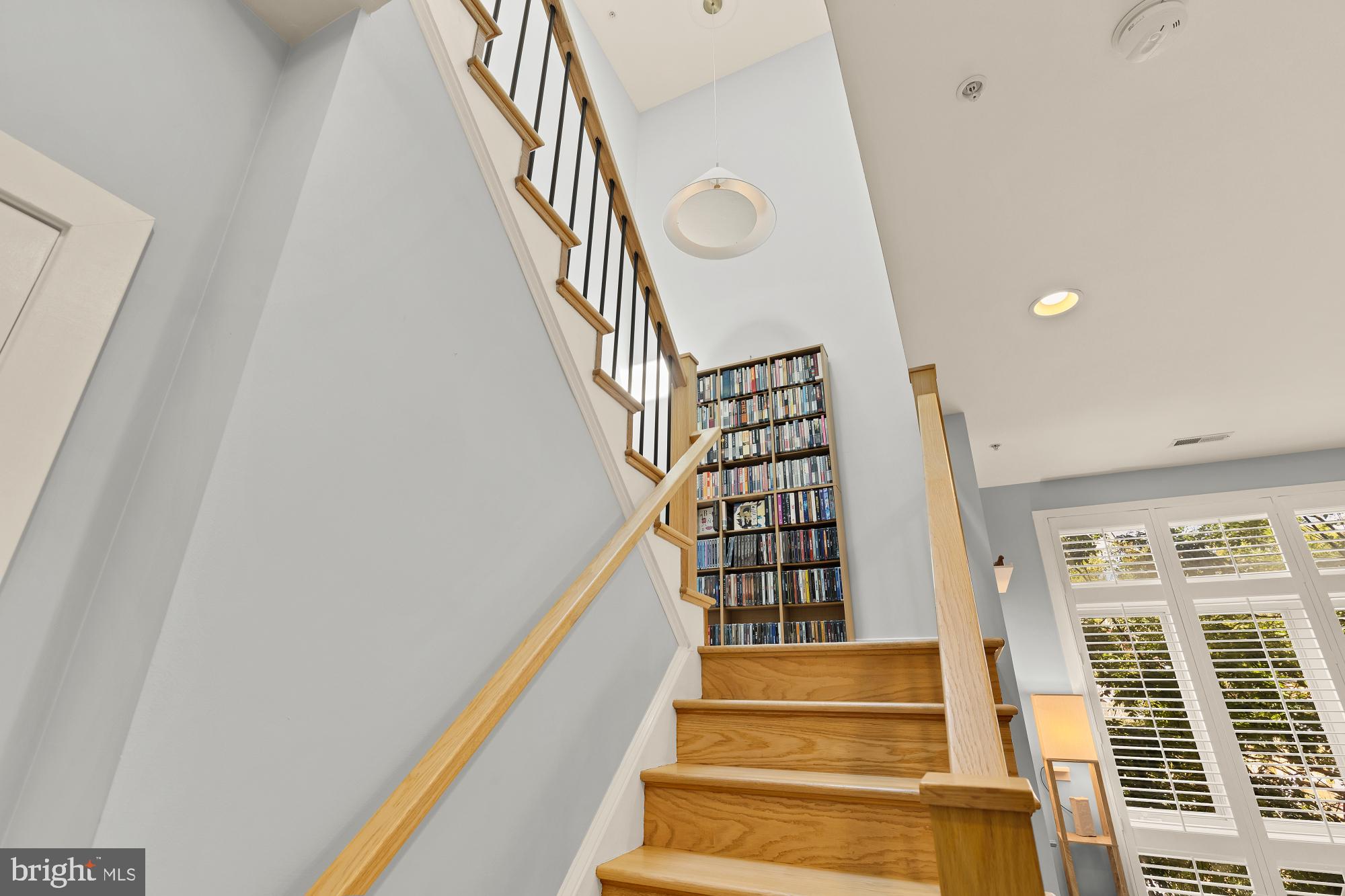 2363 Champlain Street Northwest, Unit 26 Washington, DC 20009 - Photo 18 of 35 a view of staircase with lots of frames on wall and a large window
