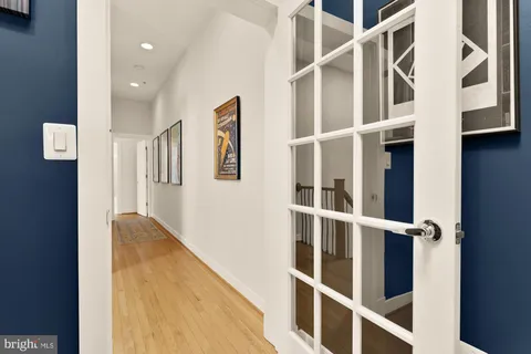 a view of an entryway with wooden floor