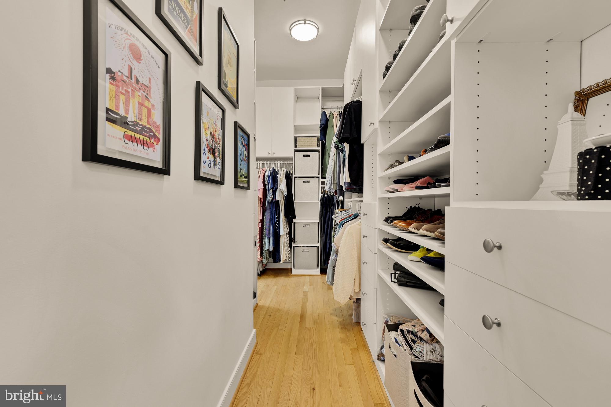 2363 Champlain Street Northwest, Unit 26 Washington, DC 20009 - Photo 23 of 35 a hallway with a white cabinets and wooden floor
