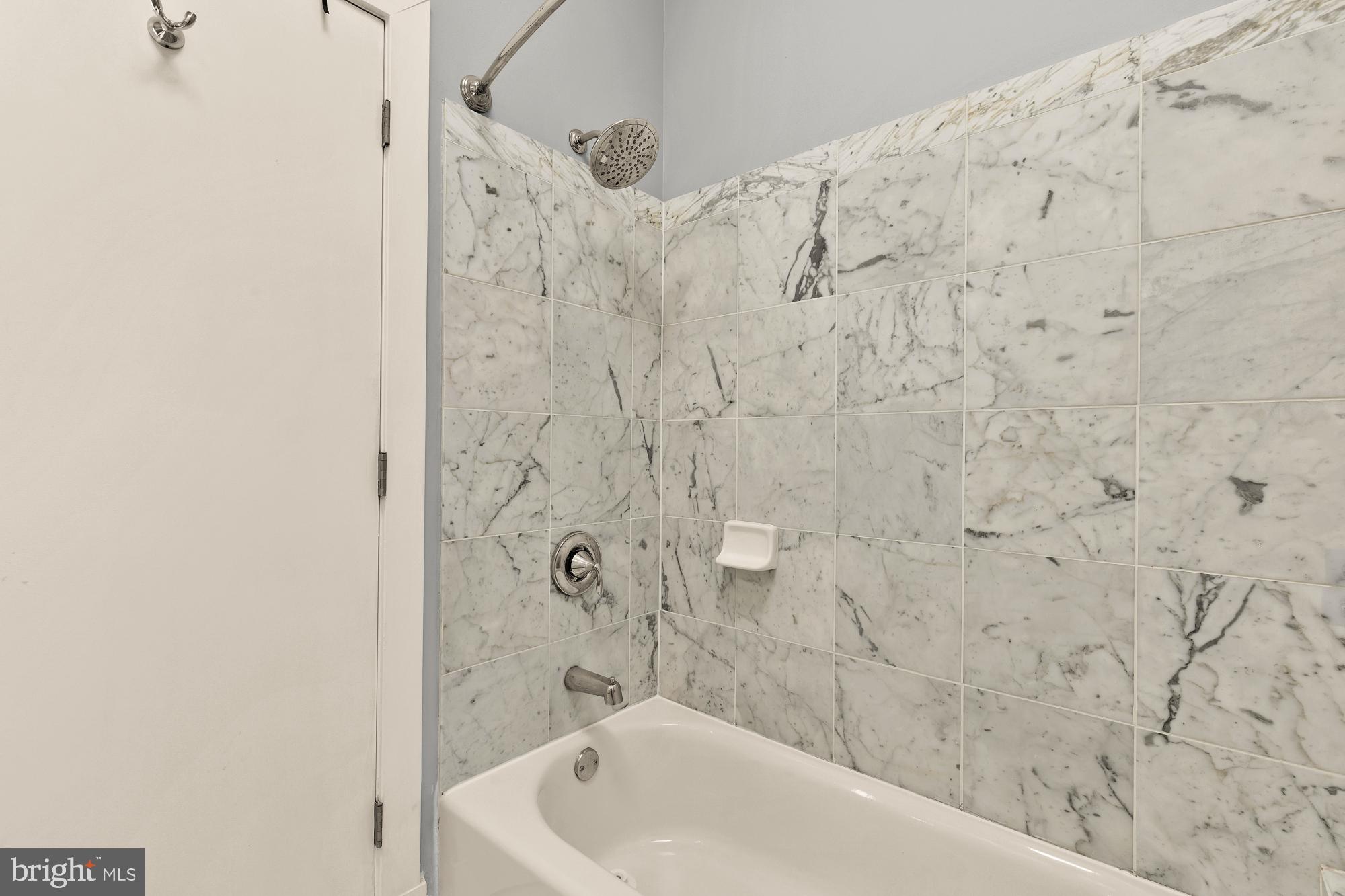 2363 Champlain Street Northwest, Unit 26 Washington, DC 20009 - Photo 25 of 35 a bathroom with a bathtub