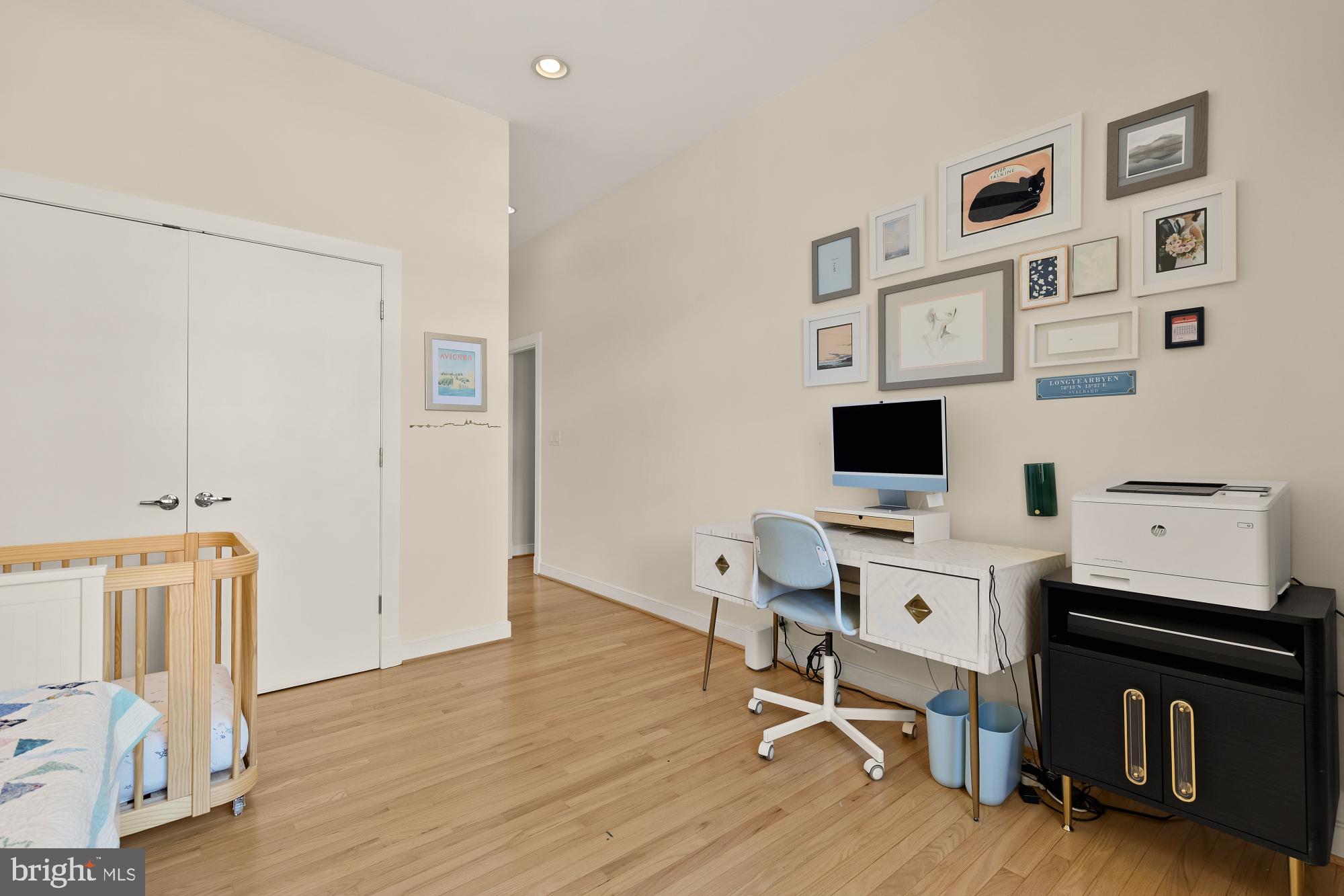 2363 Champlain Street Northwest, Unit 26 Washington, DC 20009 - Photo 29 of 35 a view of a workspace with furniture and a flat screen tv