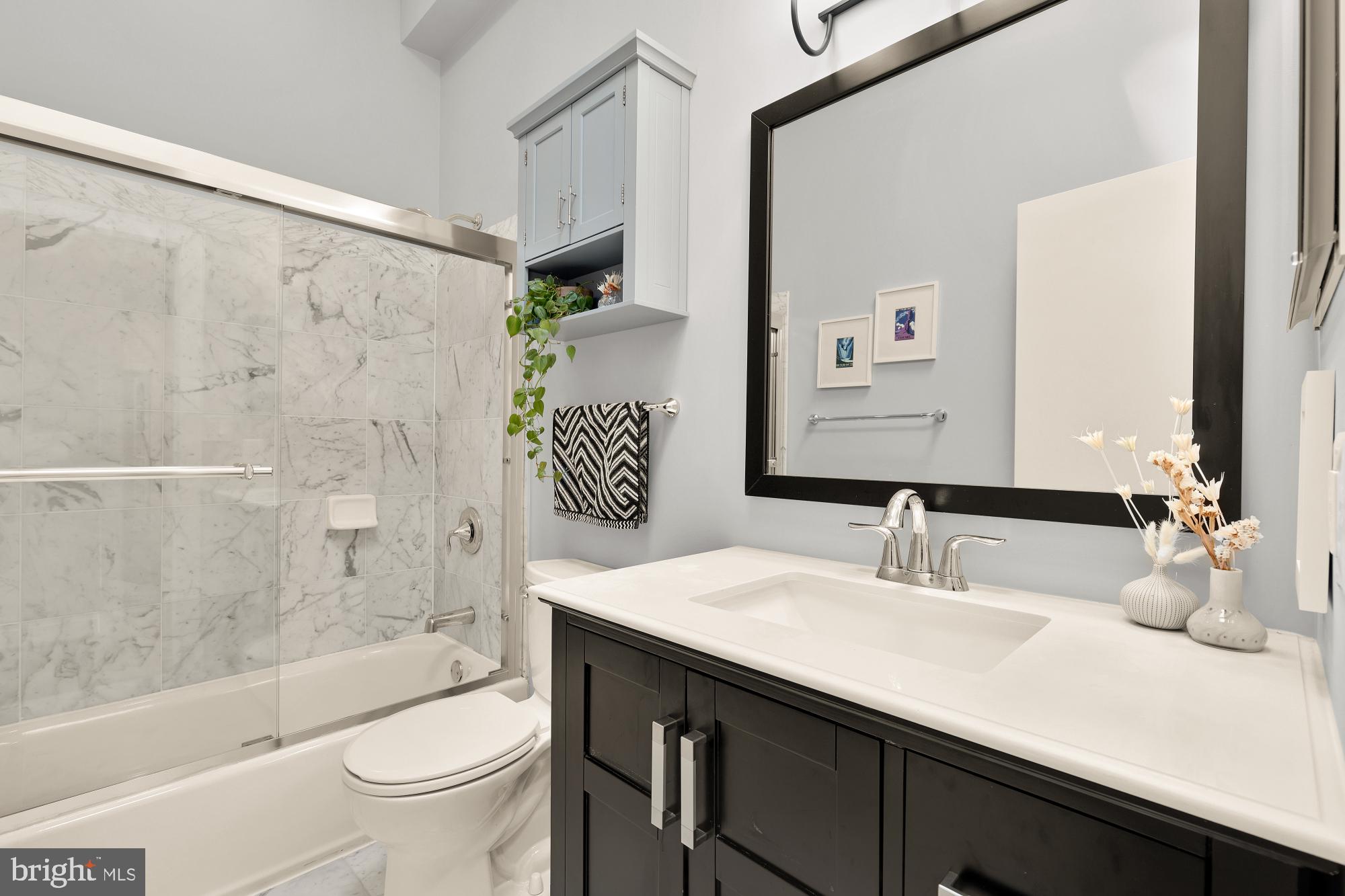 2363 Champlain Street Northwest, Unit 26 Washington, DC 20009 - Photo 30 of 35 a bathroom with a sink and a mirror