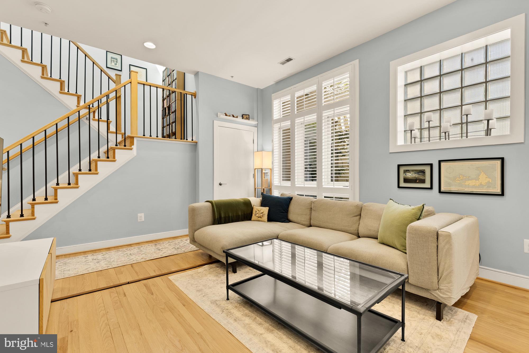 2363 Champlain Street Northwest, Unit 26 Washington, DC 20009 - Photo 5 of 35 a living room with furniture and a window