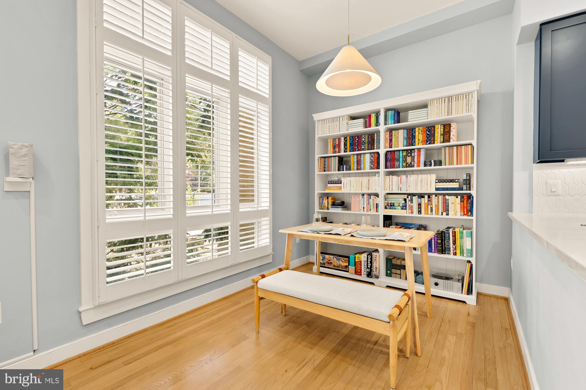 2363 Champlain Street Northwest, Unit 26 Washington, DC 20009 - Photo 9 of 35 a living room with furniture and a book shelf