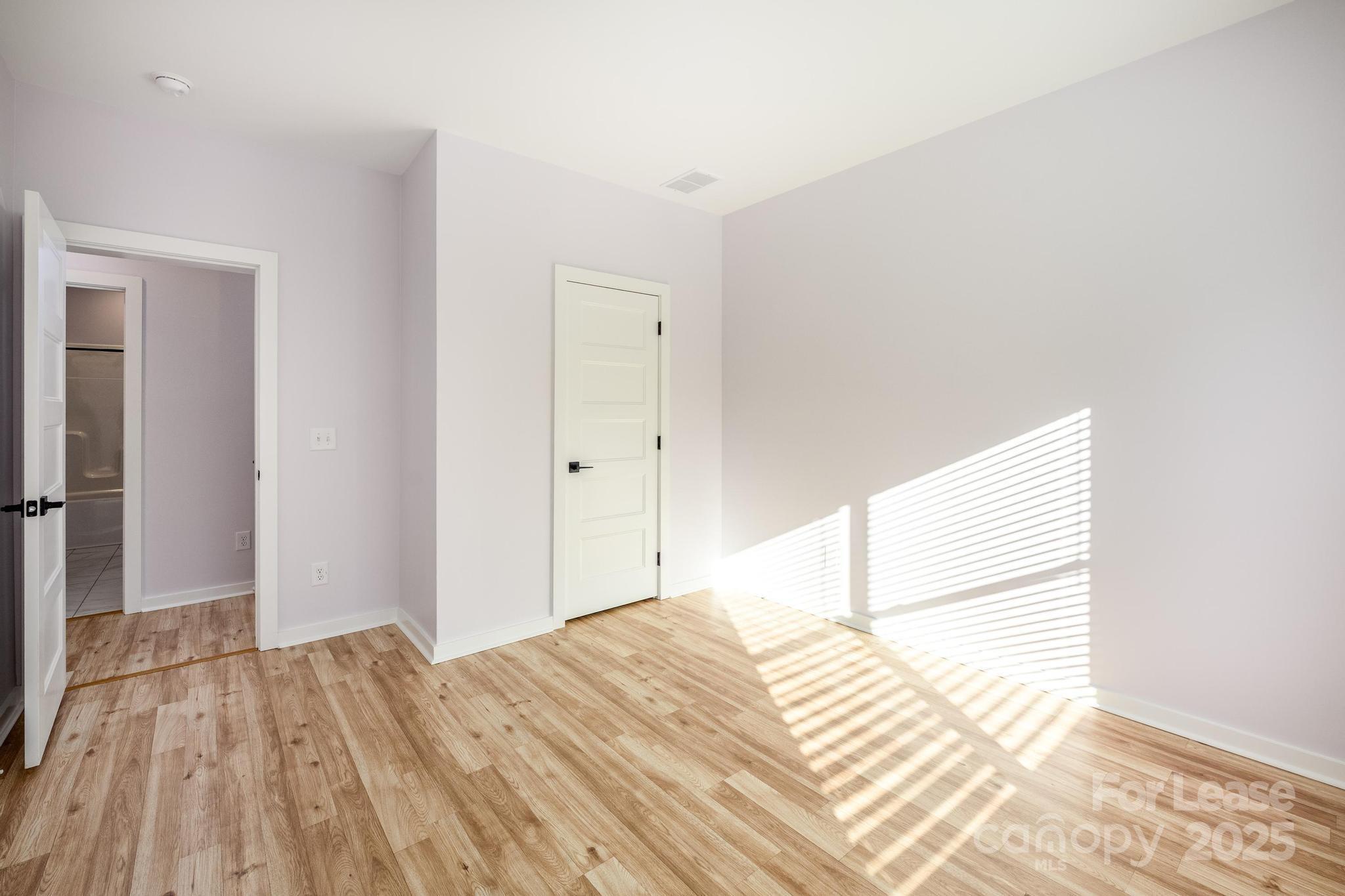 7039 Executive Circle Denver, NC 28037 - Photo 26 of 48 a bedroom with a bed and a window