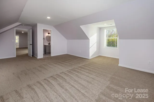 an empty room with windows and entrance