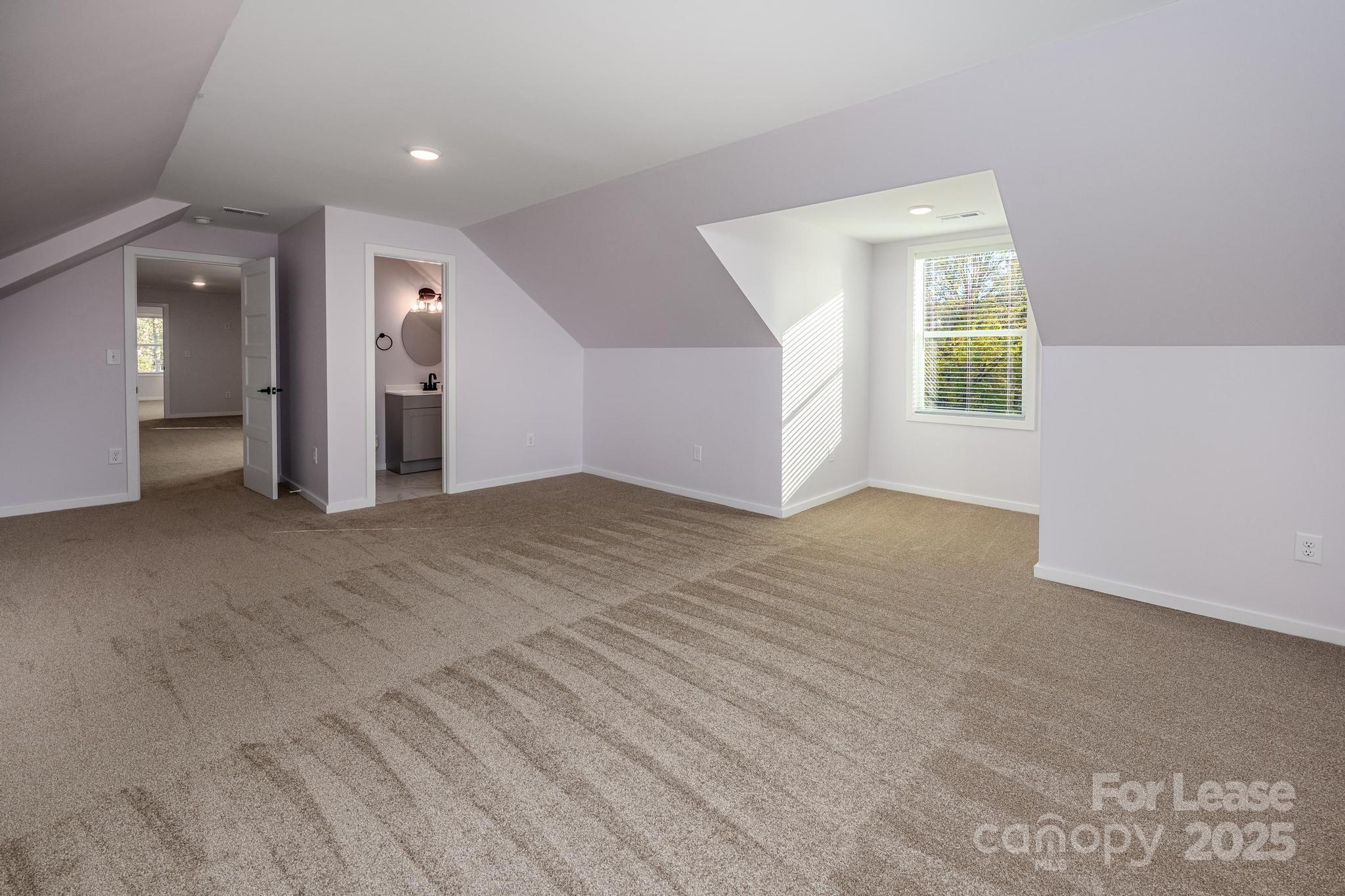 7039 Executive Circle Denver, NC 28037 - Photo 32 of 48 an empty room with windows and entrance