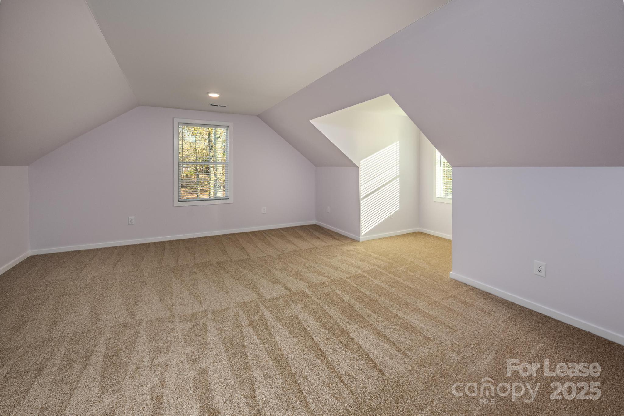 7039 Executive Circle Denver, NC 28037 - Photo 34 of 48 an empty room with a window