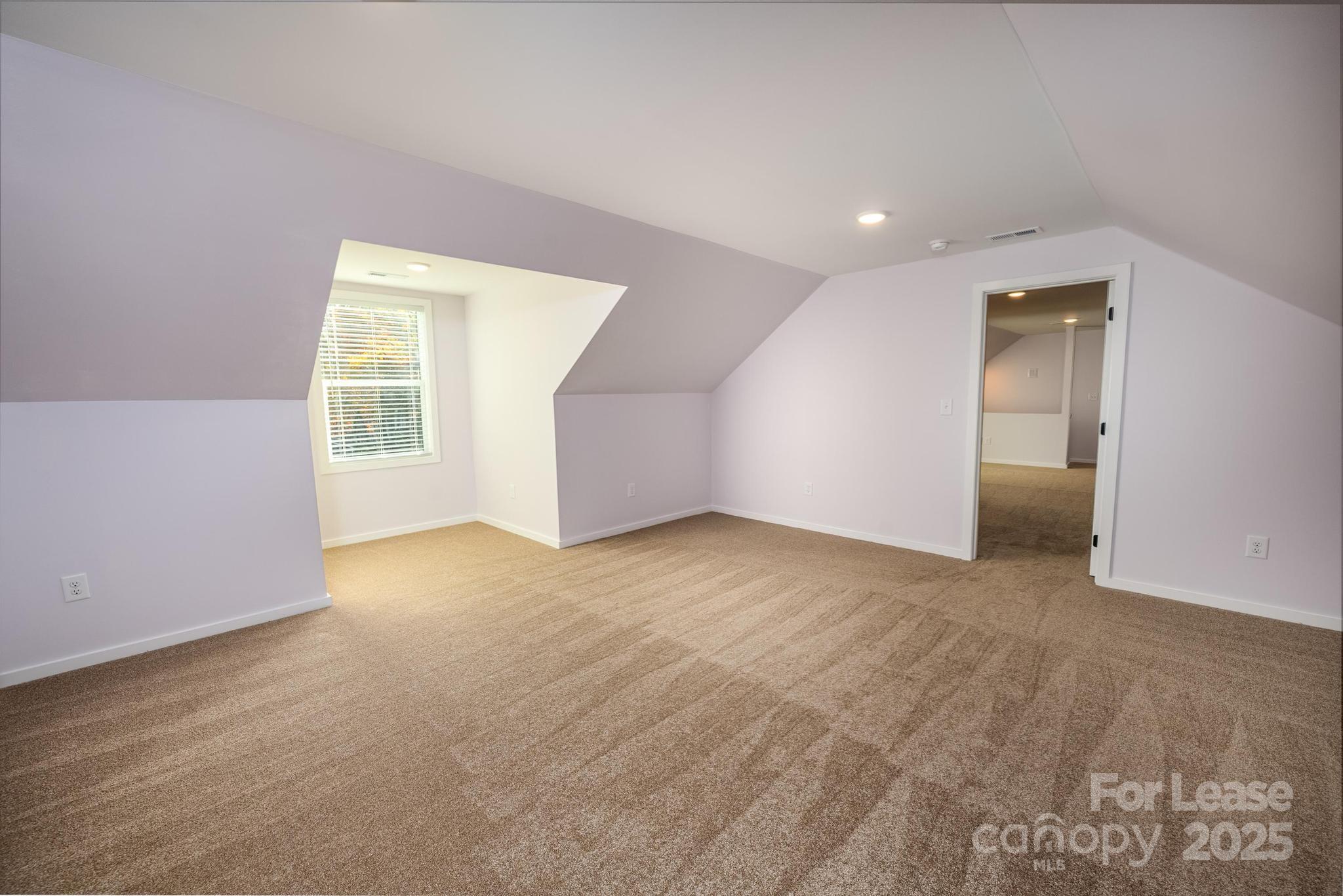 7039 Executive Circle Denver, NC 28037 - Photo 36 of 48 a view of an empty room with a window