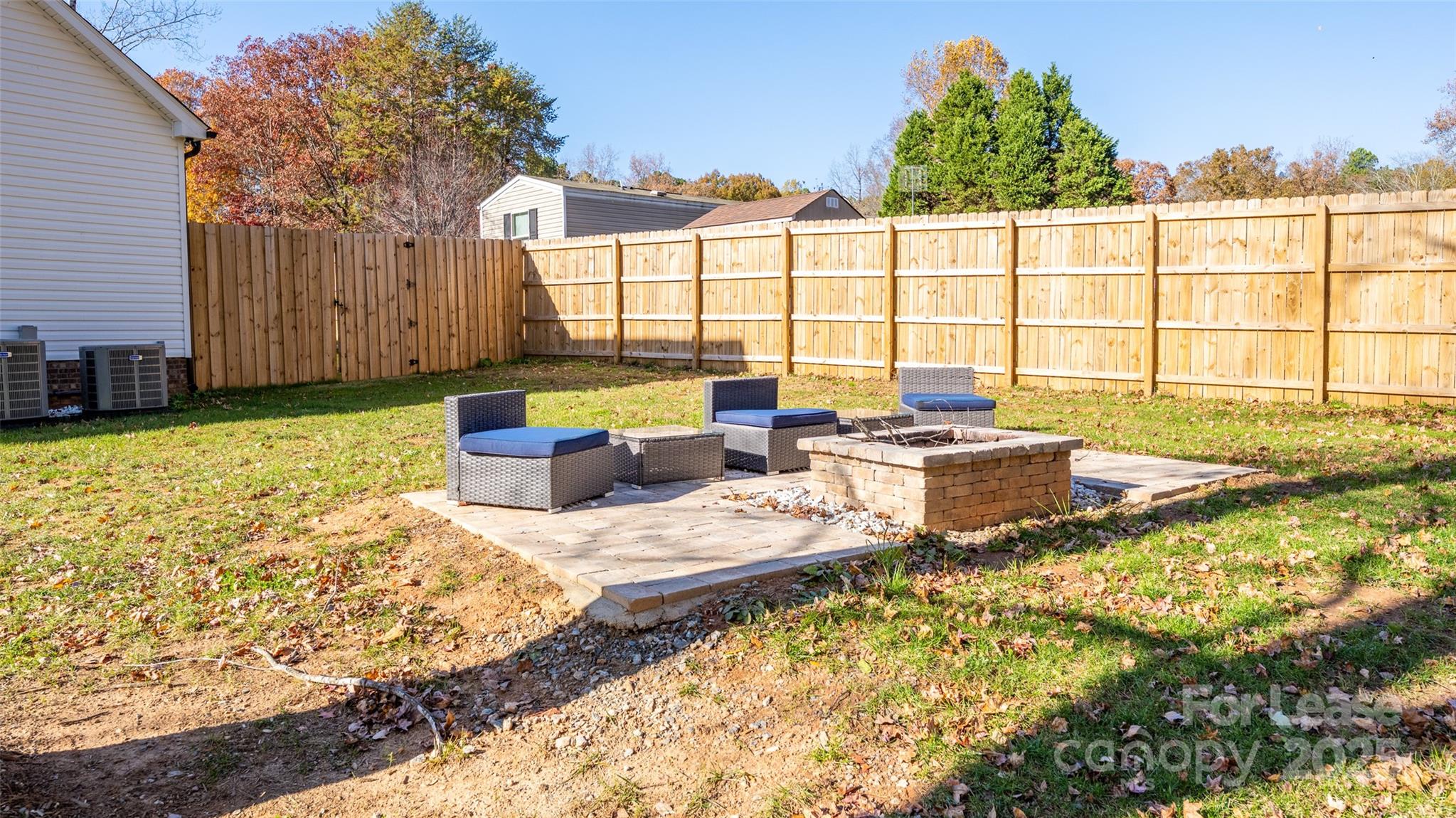 7039 Executive Circle Denver, NC 28037 - Photo 41 of 48 a view of a swimming pool with a lounge chairs