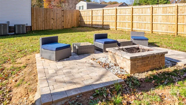 a view of an outdoor sitting area with kitchen furniture