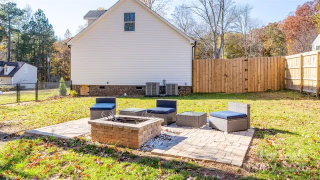 a view of a backyard with swimming pool