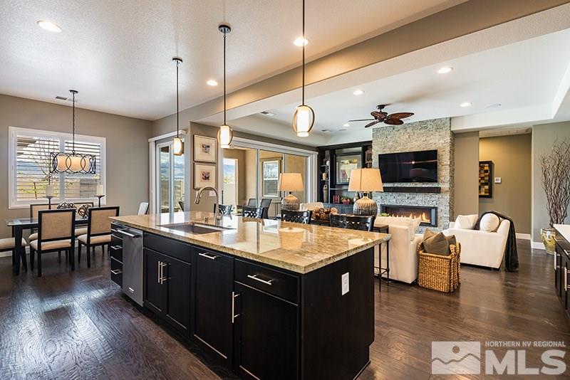 2030 Blue Boy Lane Reno, NV 89521 - Photo 8 of 25 a large kitchen with lots of counter space a sink appliances and living room view