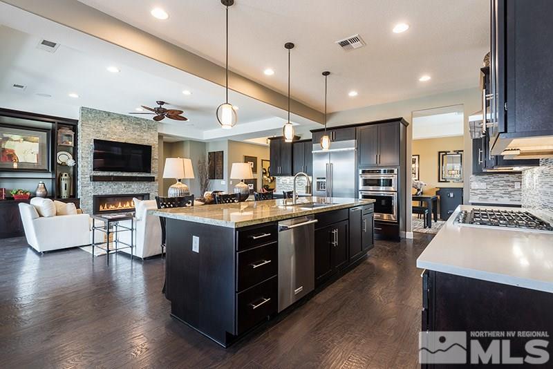 2030 Blue Boy Lane Reno, NV 89521 - Photo 10 of 25 a large kitchen with stainless steel appliances lots of counter space a sink and a couch