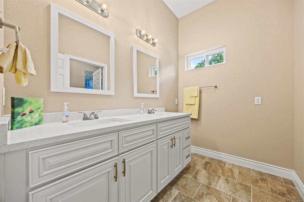 5230 Esquire Estates Road Mabank, TX 75156 - Photo 12 of 19 a bathroom with a sink and a mirror