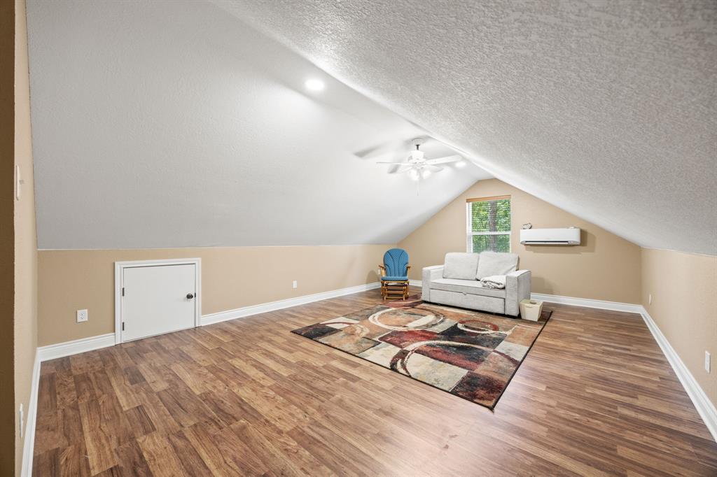 5230 Esquire Estates Road Mabank, TX 75156 - Photo 13 of 19 a living room with a couch and a table