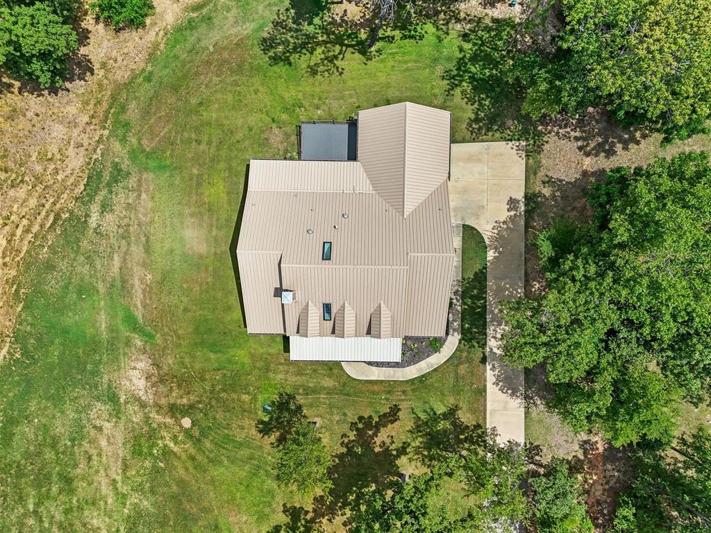 5230 Esquire Estates Road Mabank, TX 75156 - Photo 17 of 19 an aerial view of a house with outdoor space and trees all around