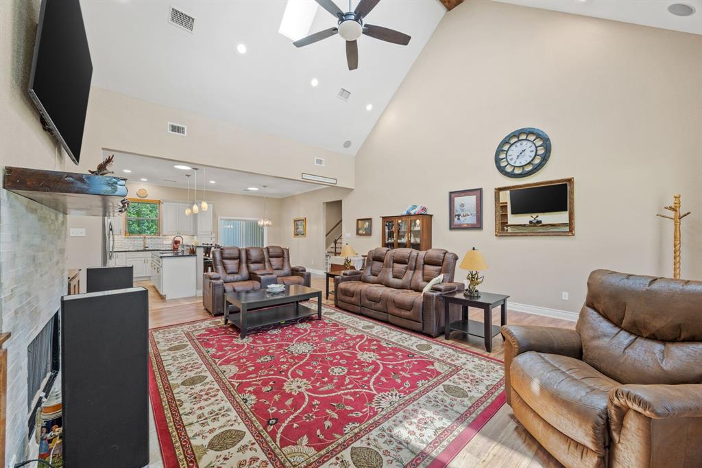 5230 Esquire Estates Road Mabank, TX 75156 - Photo 4 of 19 a living room with furniture and a flat screen tv