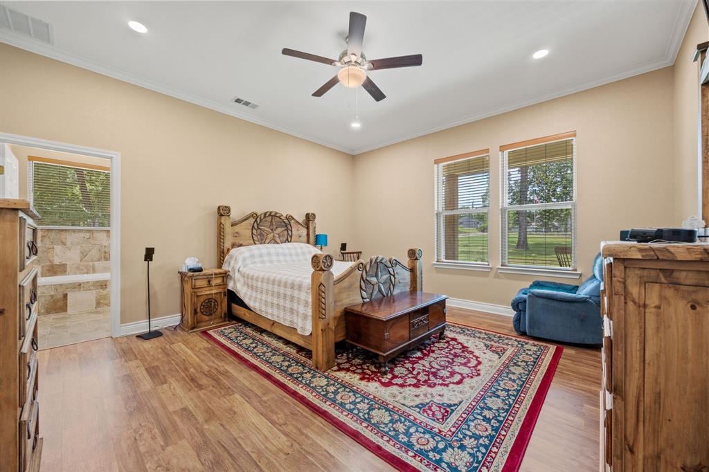 5230 Esquire Estates Road Mabank, TX 75156 - Photo 8 of 19 a bedroom with furniture and a rug