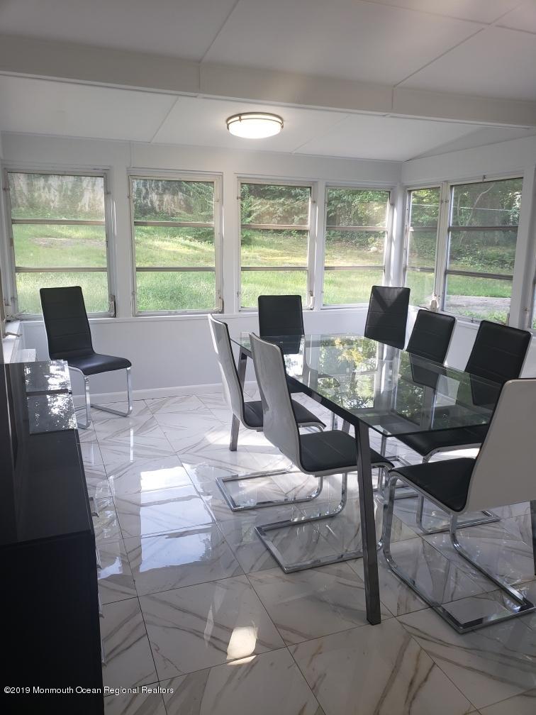 240 Castlewall Avenue Elberon, NJ 07740 - Photo 2 of 6 a view of a dining room with furniture window and outside view