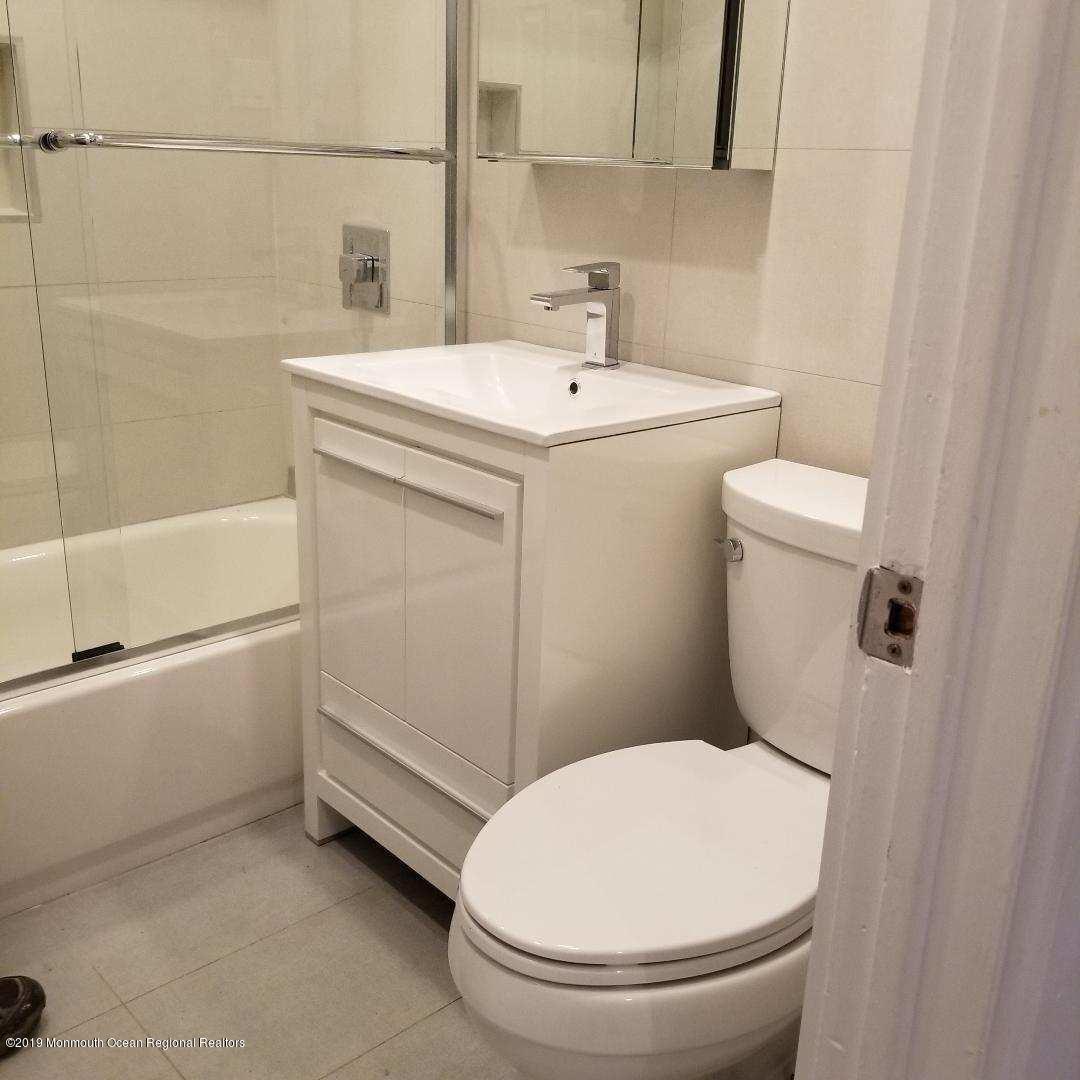 240 Castlewall Avenue Elberon, NJ 07740 - Photo 5 of 6 a bathroom with a sink a toilet and shower
