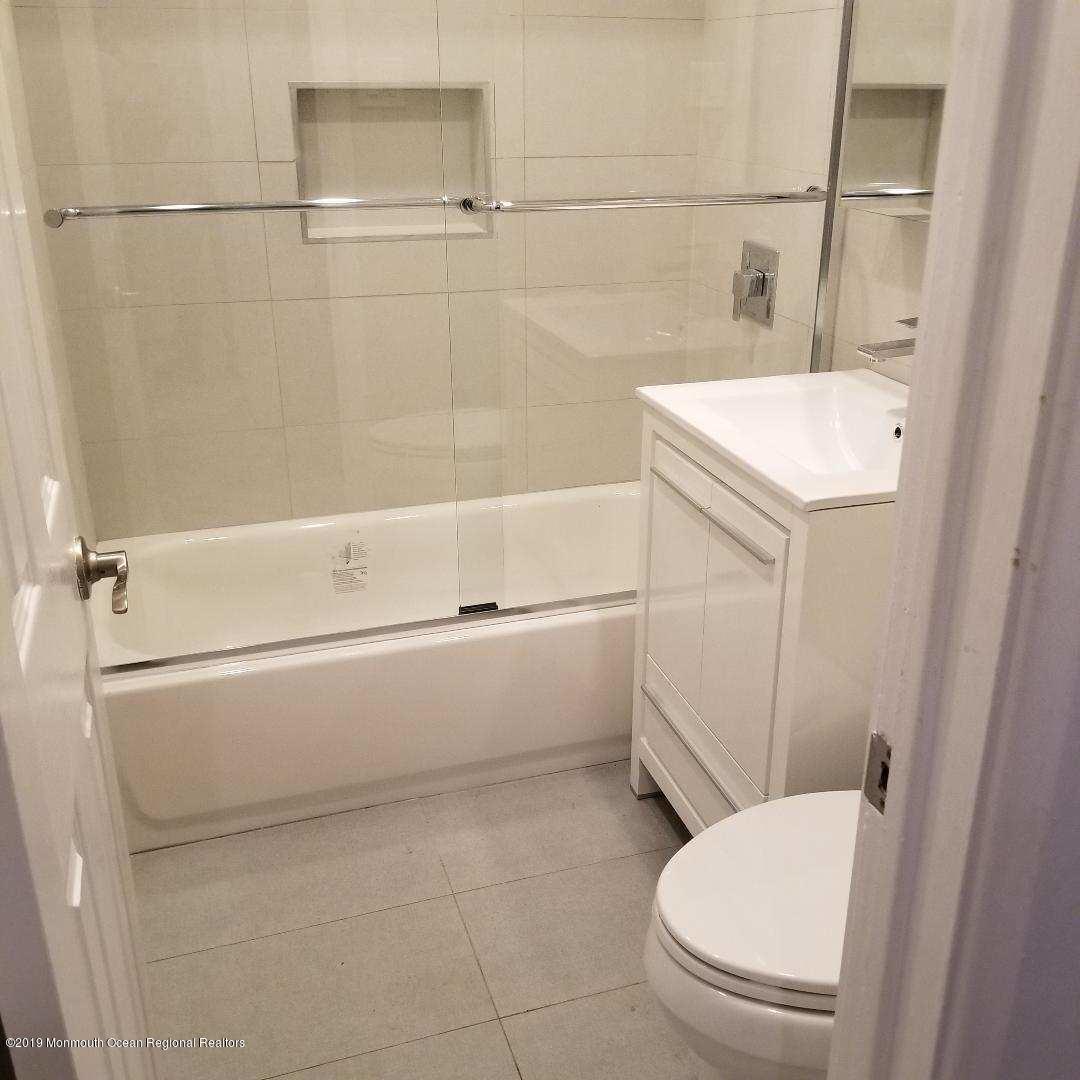240 Castlewall Avenue Elberon, NJ 07740 - Photo 6 of 6 a bathroom with a sink a toilet and bathtub