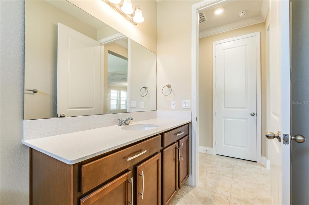 8278 Procida Isle Lane Windermere, FL 34786 - Photo 45 of 90 a bathroom with a sink and a mirror