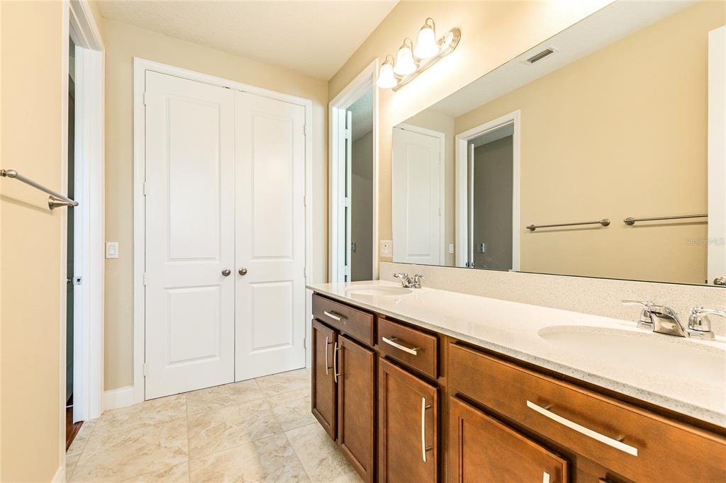 8278 Procida Isle Lane Windermere, FL 34786 - Photo 69 of 90 a bathroom with a sink and a mirror