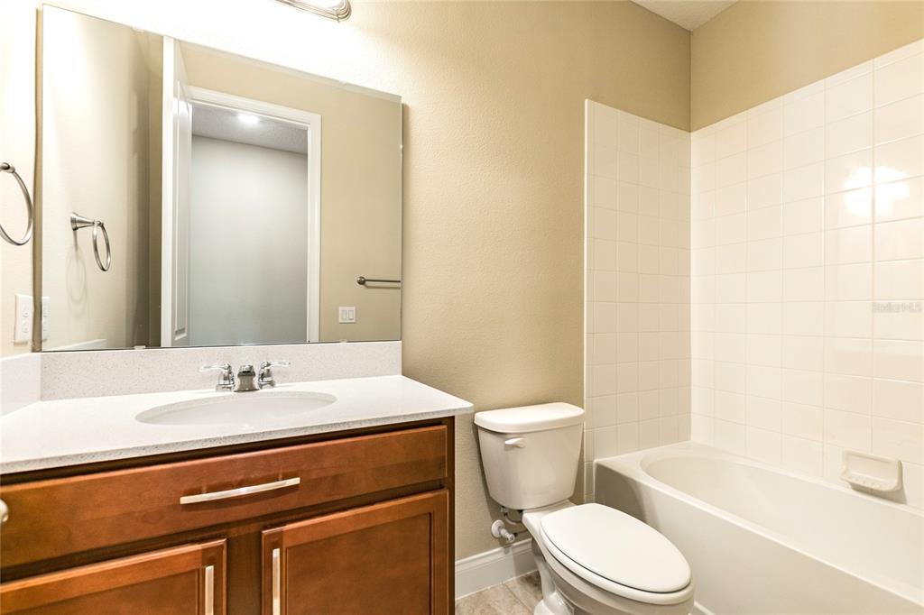 8278 Procida Isle Lane Windermere, FL 34786 - Photo 71 of 90 a bathroom with a sink a toilet and shower