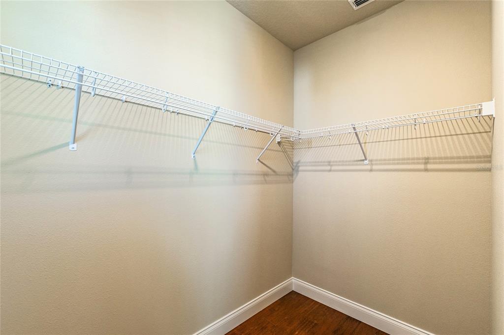 8278 Procida Isle Lane Windermere, FL 34786 - Photo 80 of 90 a view of a room with racks on the wall