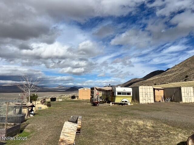 76770 Fish Springs Road Reno, NV 89510 - Photo 7 of 18 a view of a big house with wooden fence