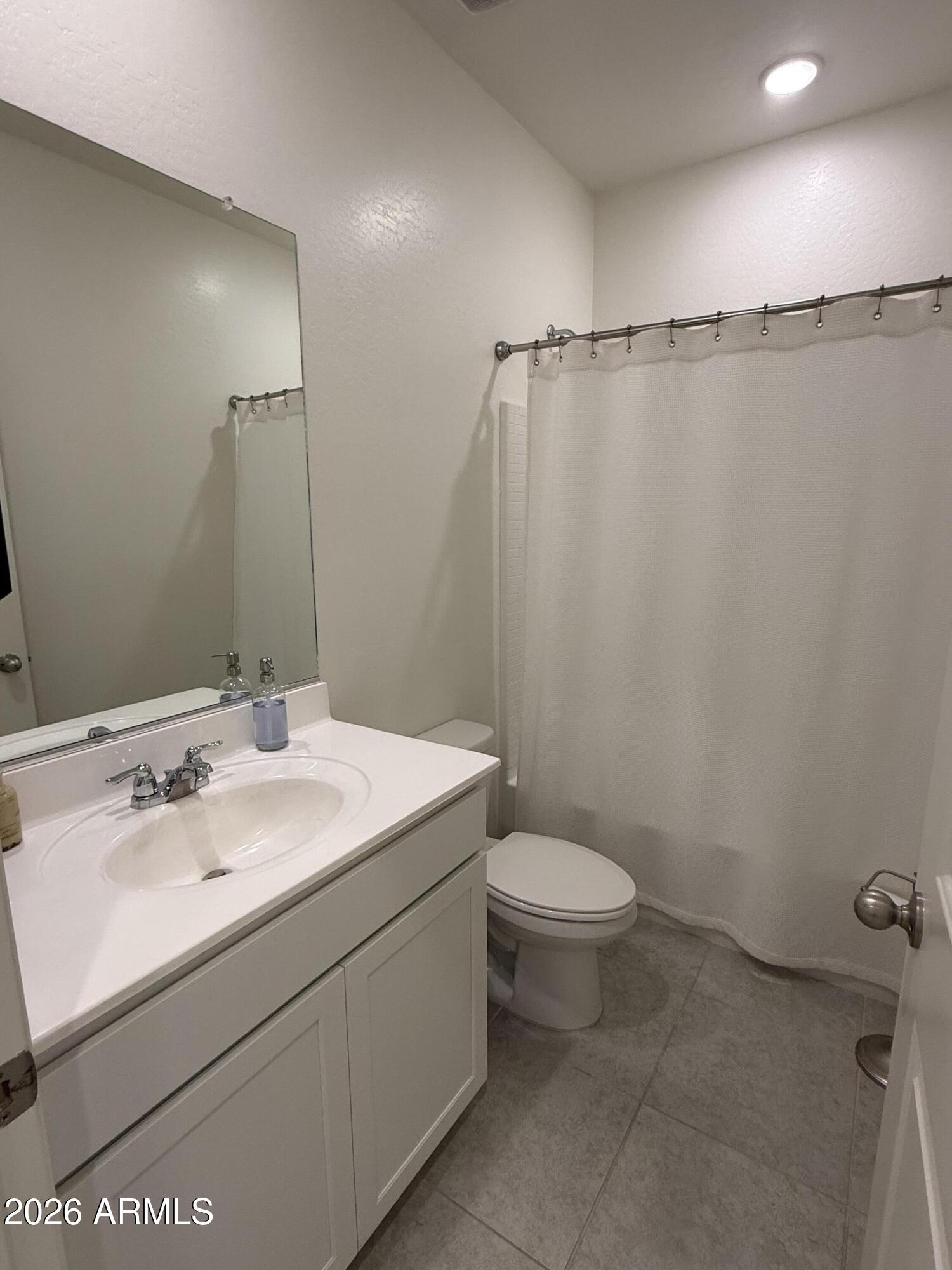 25839 North Boreas Road Florence, AZ 85132 - Photo 6 of 20 a bathroom with a sink and a mirror
