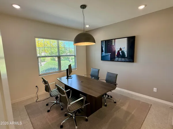 a workspace with furniture and window