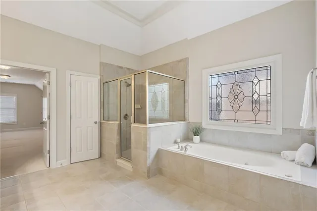 a bathroom with a tub and shower