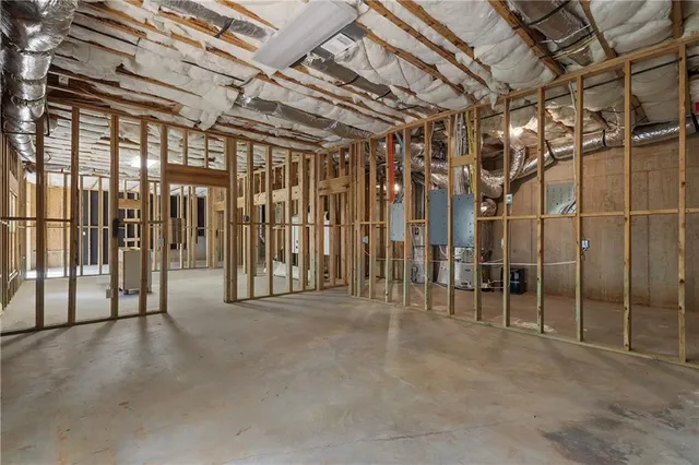 a view of empty room with wooden walls