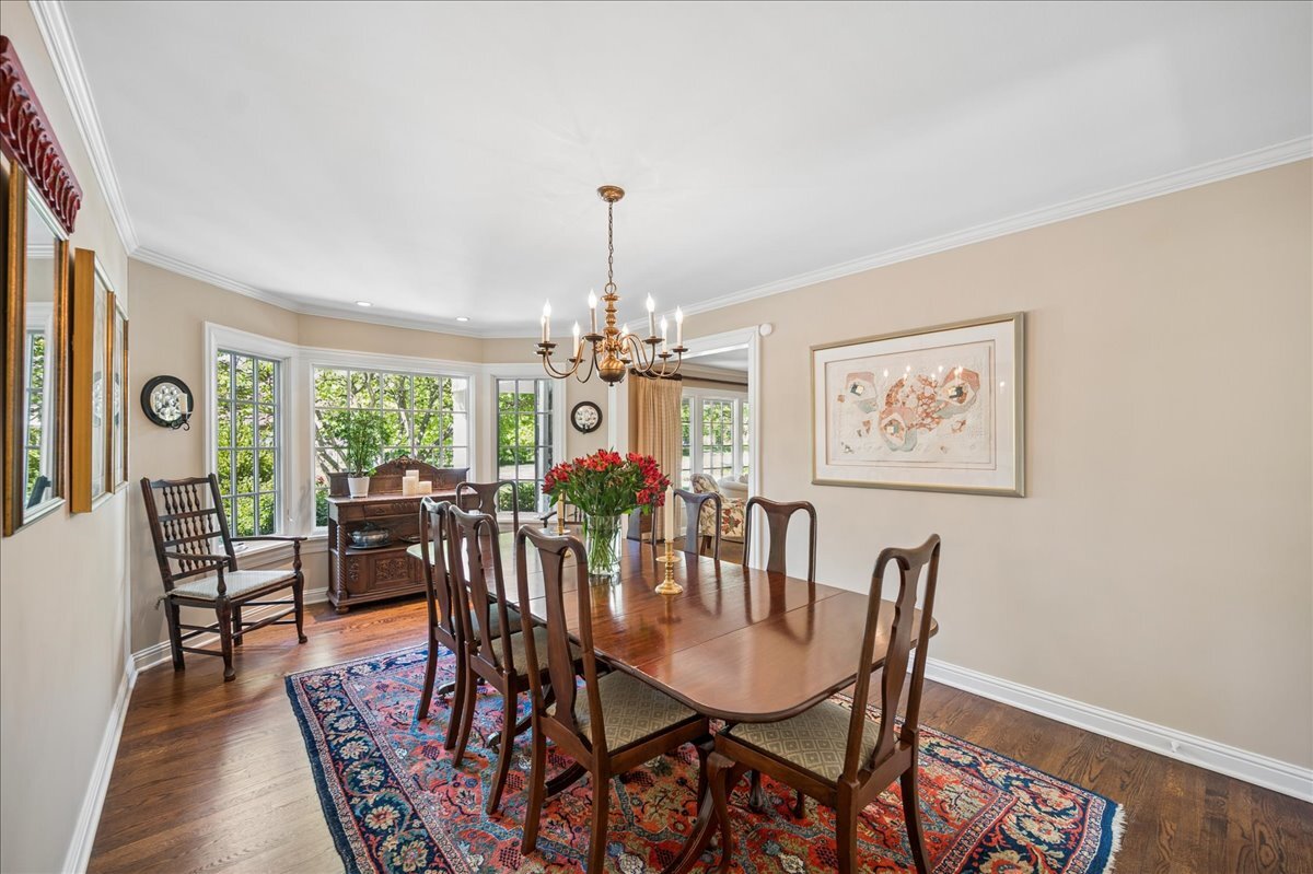 253 Summerfield Road Northbrook, IL 60062 - Photo 12 of 46 a view of a dining room with furniture window and wooden floor