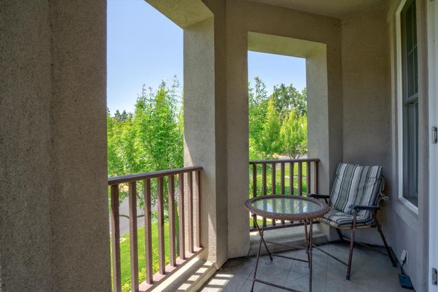 a view of a balcony with wooden floor