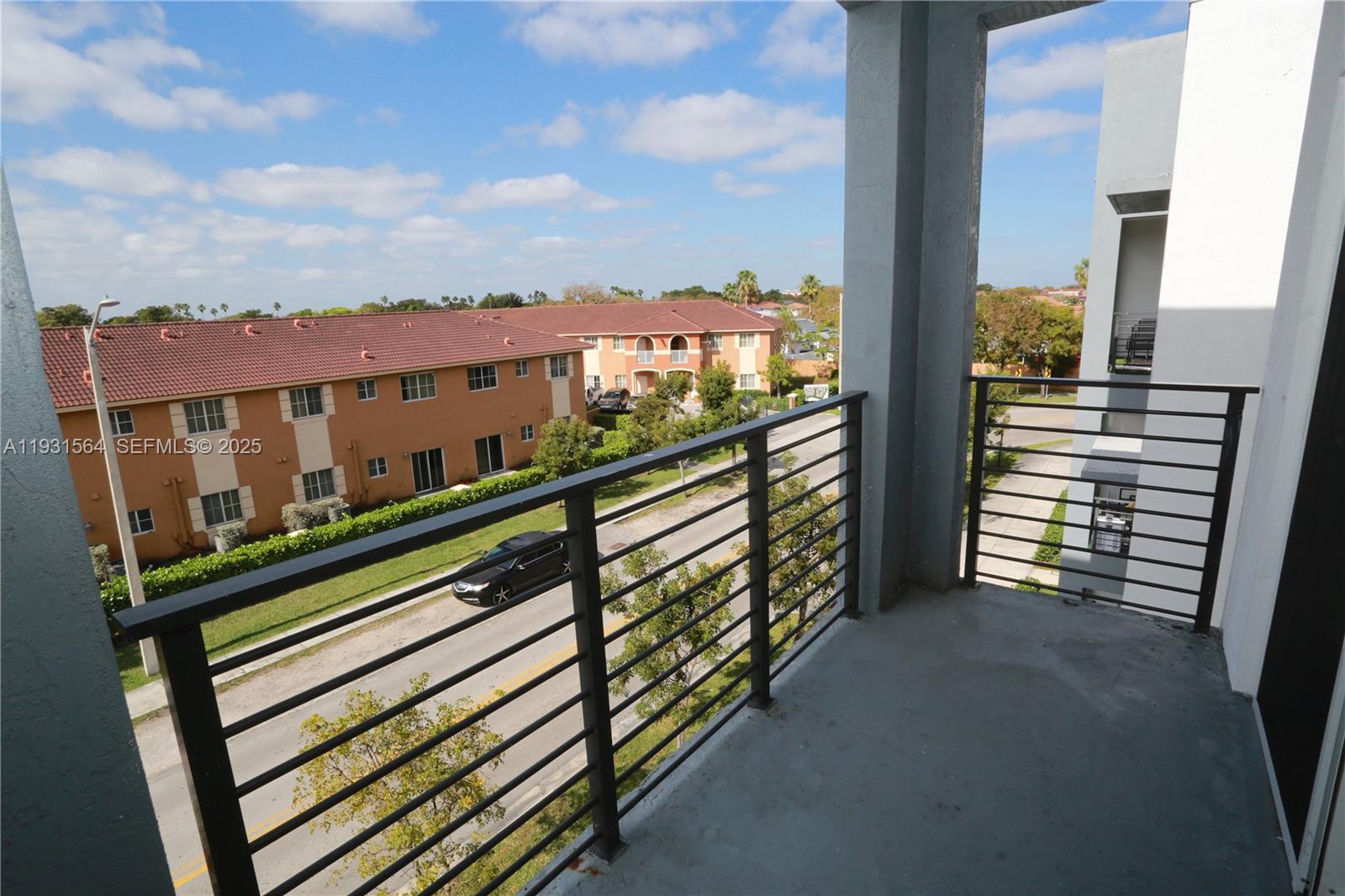 6151 Northwest 182nd Lane, Unit 301 Hialeah, FL 33015 - Photo 11 of 13 a view of a balcony with city view