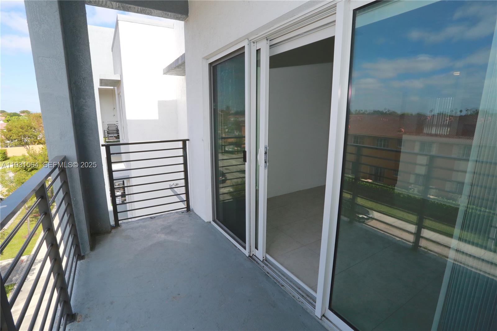 6151 Northwest 182nd Lane, Unit 301 Hialeah, FL 33015 - Photo 13 of 13 a view of a bathroom with a glass door