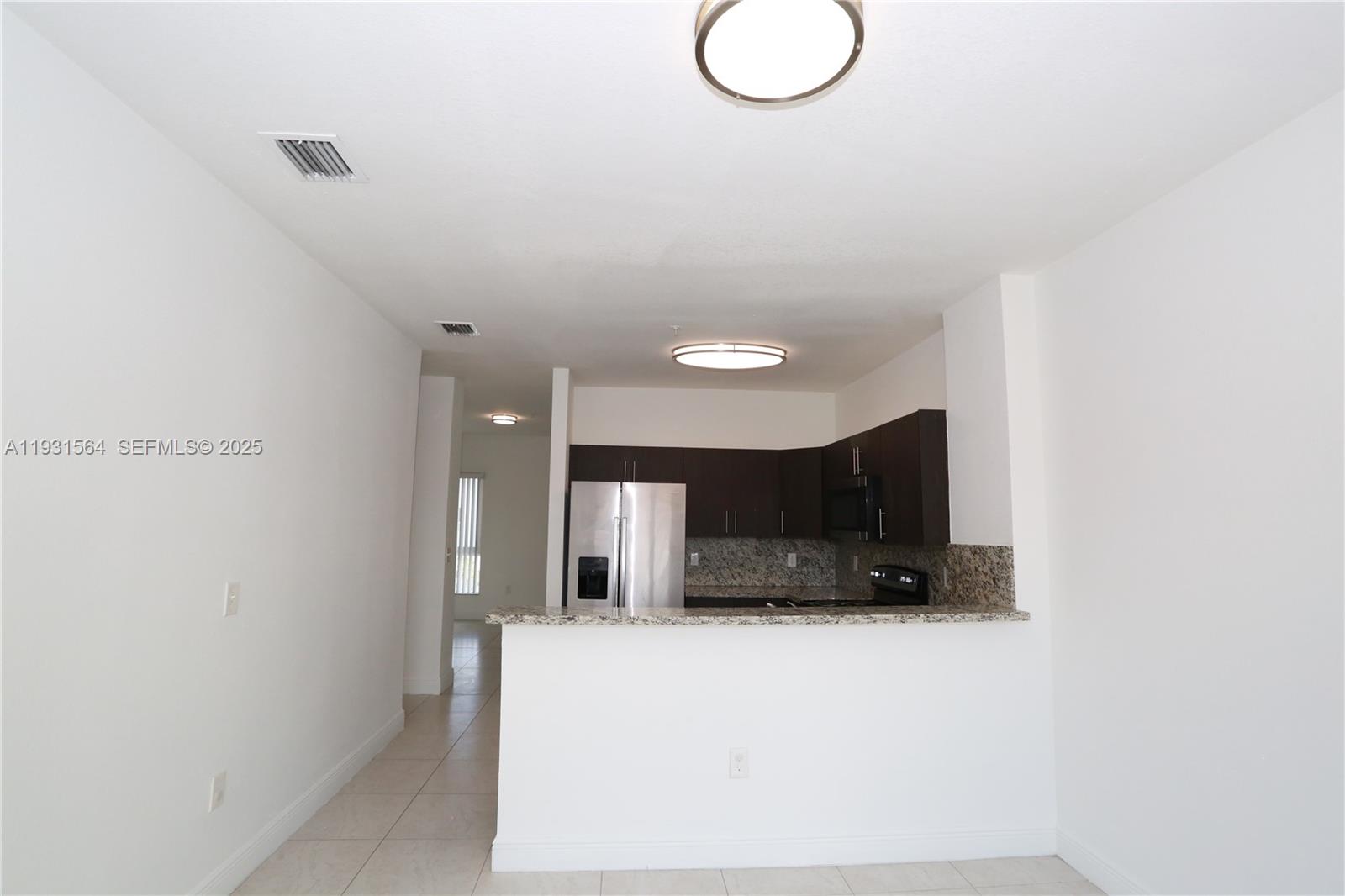 6151 Northwest 182nd Lane, Unit 301 Hialeah, FL 33015 - Photo 6 of 13 a view of a kitchen with a sink